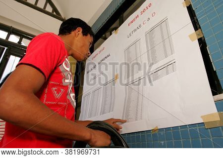 Eunapolis, Bahia / Brazil - November 6, 2010: People Look At Attendance List For Exams Of The Nation
