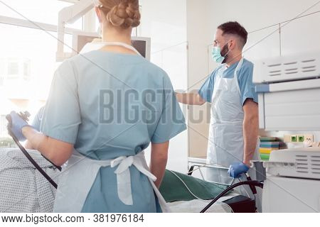 doctors in internal department of hospital performing endoscopy in surgery