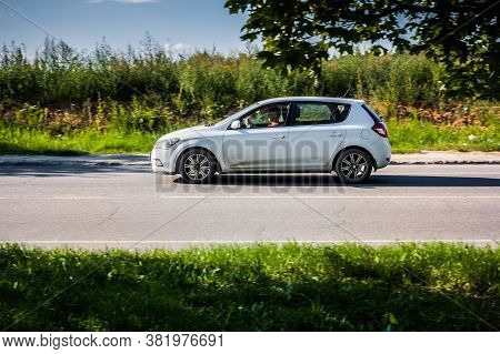 Moscow, Russia - August 16, 2020: Fast Moving Kia Cee'd Ew On The Country Road. Compact White Hatchb
