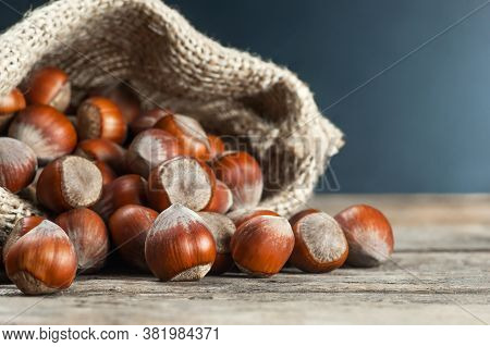 Hazelnuts, Filbert On Old Wooden Table. Heap Or Stack Of Hazel Nuts. Hazelnut Background, Healty Foo