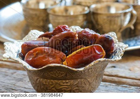 Ramadan Palm Fruit Dates In Silver Bowl And Zam Zam Water Symbolize Sacred Month For Muslims. Ramada