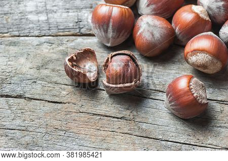 Hazelnuts, Filbert On Old Wooden Table. Heap Or Stack Of Hazel Nuts. Hazelnut Background, Healty Foo