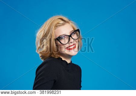 Blonde With Short Hair Red Lips Glasses Black Jacket Blue Isolated Background