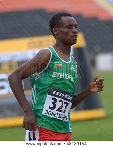 DONETSK, UKRAINE - JULY 11: Mathiwos Yotota of Ethiopia competes in the heat on 1500 meters during 8th IAAF World Youth Championships in Donetsk, Ukraine on July 11, 2013