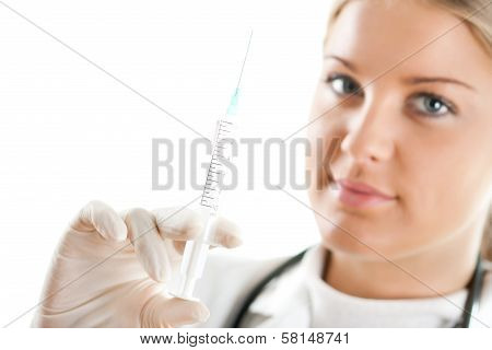Female doctor holding a syringe in her hand