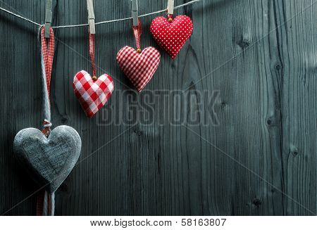 Valentine's Day wallpaper - Textile hearts hanging on the rope ascending order