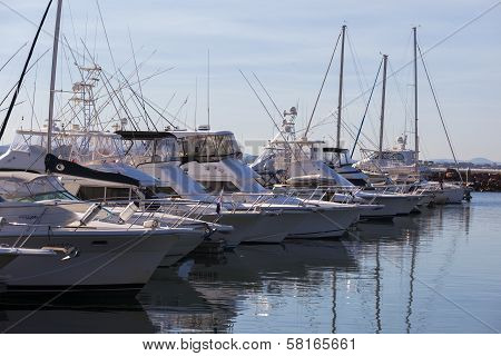 Yacht Or Motor Boat At Harbor Moored At Marina. Port  Stephens. Nelson Bay.  Australia.