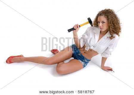 Beautiful curly girl holding yellow hummer and nail