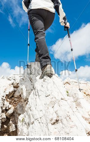 Young Woman Ascending A Mountain Ridge