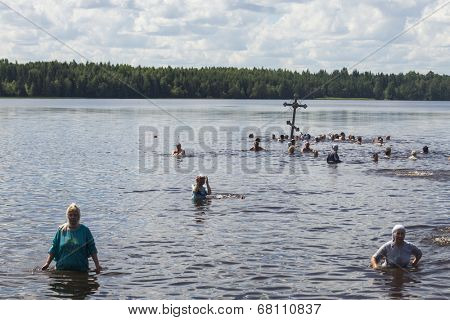 KRASNY BRONEVIK, RUSSIA - JULY 7, 2014: Celebrations commemorating the Rev. Anthony Dymsky (died 1224) in Antony Dymsky Monastery - Procession on Lake Dymsky, the great blessing of water and bathing.