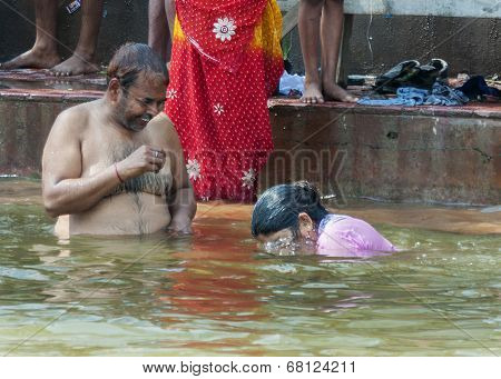 Having Fun During Ritual Bathing In The Ganges River.