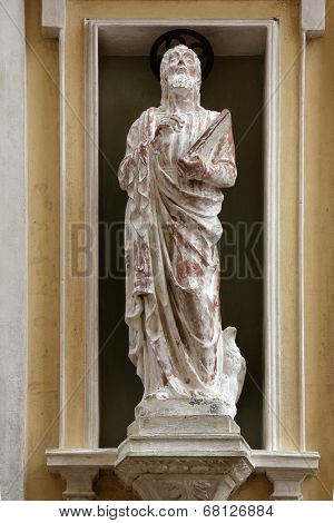 PORTOFERRAIO, ELBA, ITALY - MAY 03, 2014: St. John the Evangelist on the facade of the Church of Mercy in Portoferraio, Island of Elba, Tuscany, Italy on May 03, 2014 