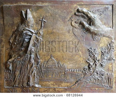 PORT AZZURRO, ELBA, ITALY - MAY 03, 2014: Pope John Paul II, detail on the door of the church of St. James the Greater. Church is located inside the fort of the same name in Porto Azzurro