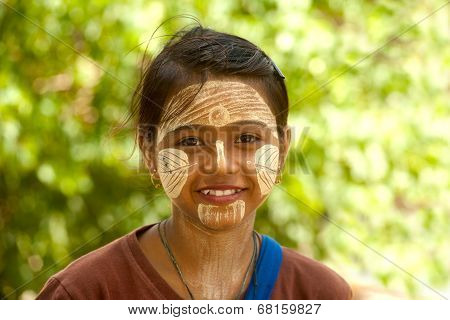 Woman With Thanaka On Her Face In Myanmar.