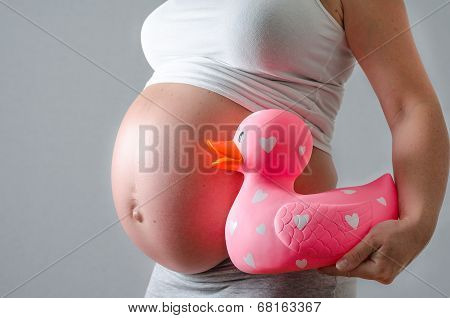 pregnant woman showing her belly