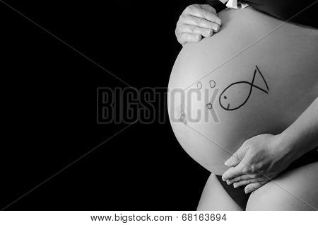 pregnant woman showing her belly
