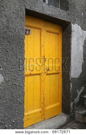 RIOMAGGIORE, ITALY - MAY 02, 2014: Brightly color door in Riomaggiore, one of the Cinque Terre villages, UNESCO World Heritage Sites, Riomaggiore, Liguria, Italy, on May 02, 2014