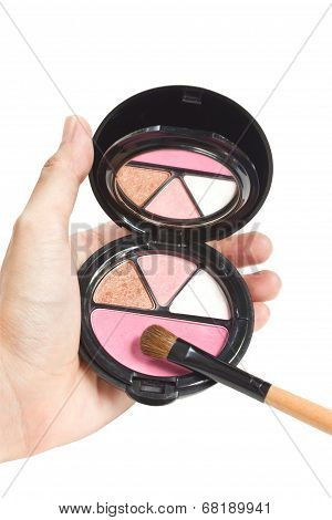 Multicolor Make Up Palette With Brush In Hand.