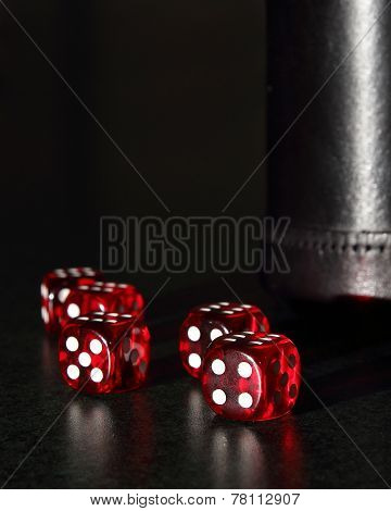 Red Dice With A Black Dice Cup