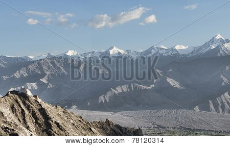 Panorama Of Ancient Casttle On Cliff Among High Mountains
