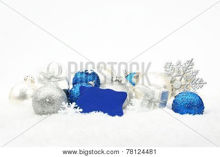 Silver And Blue Christmas Decoration On Snow With Wishes Card