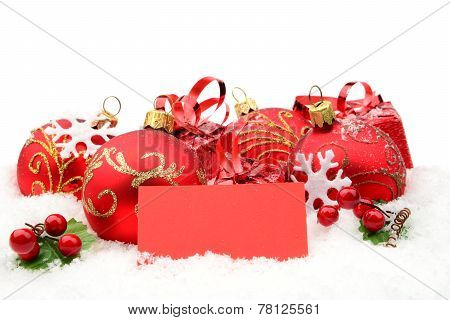 Red Christmas Decoration On Snow With Wishes Card