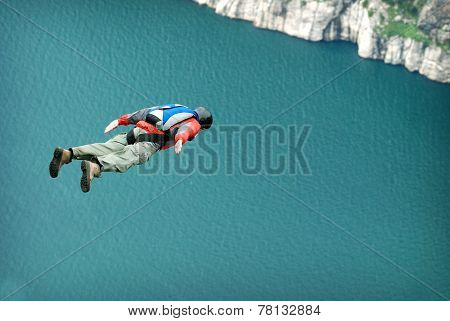 BASE jump off a cliff.