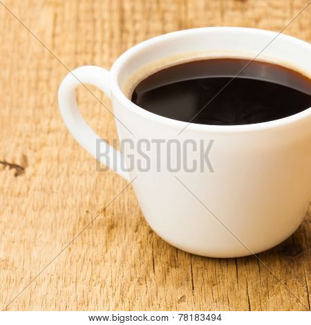 Black Coffee In White Ceramic Cup On Wooden Table - Studio Shoot
