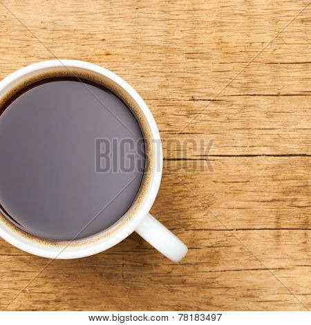 Black Coffee In White Ceramic Cup On Wooden Table - View From Top