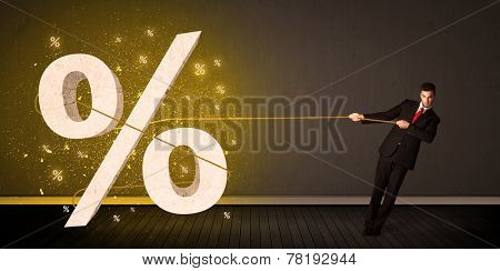 Business man pulling rope with big procent symbol sign concept on background