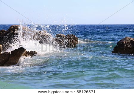 Waves Break Againstthe Rocks.