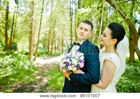 Gorgeus Wedding Couple On Green Sunny Forest