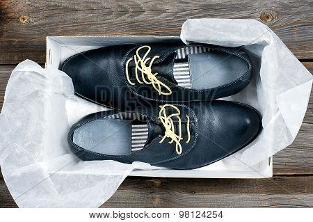 italian leather shoes concept: boots laced with spaghetti