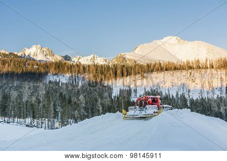 Red Snowmobile In The Mountains
