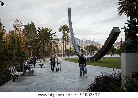 Nice France - November 3 2016: Elderly people walk on a Promenade du Paillon park famous with its flat fountains in Nice France.