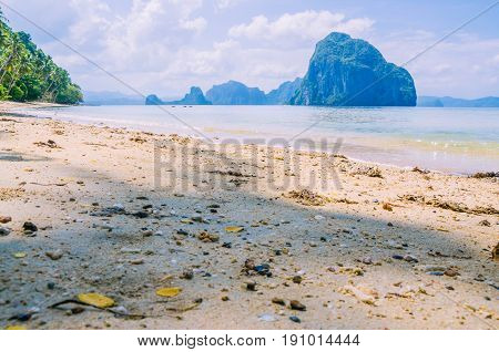 Landscape of El Nido. Sandy Beach with Huge Rock, Palawan island. Philippines.