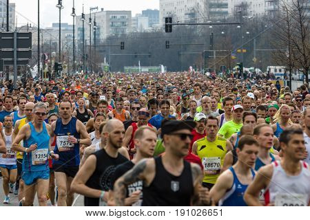 BERLIN - APRIL 02 2017: The annual 37th Berlin Half Marathon. Athletes are running. Starting line straight.