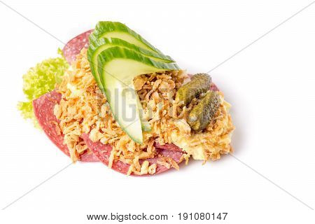 Danish specialties and national dishes high-quality open sandwich Salami with crispy fried onion remoulade and cucumber isolated on white background