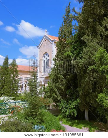 The famous Trappist monastery - Latrun. Israel. The magnificent building of the temple is surrounded by a lush garden