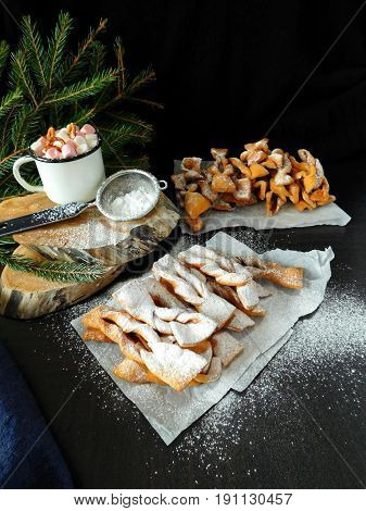 Homemade khvorost cookies are covered with sugar powder