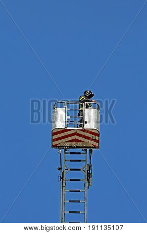 Basket With Aerial Platform Over The Special Ladder