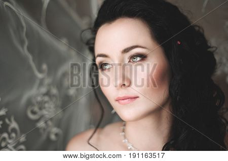 Portrait Of Beautiful Bride With Fashion Veil Posing At Home At Wedding Morning. Makeup. Blondegirl