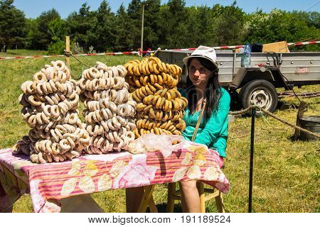 Girl Is Selling Bagels During Strawberry Festival