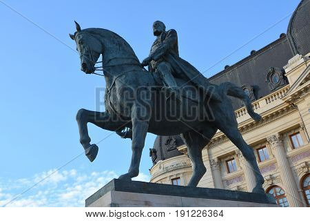 Statue of king Carol I. Typical urban landscape in the center of Bucharest - Bucuresti. Bucharest is the capital of Romania. Bucharest have 3 millions inhabitants and many historical vestiges.