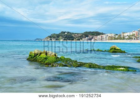 a view of the seafront of Lloret de Mar and the main beach of this popular tourist village in the Costa Brava, in Catalonia, Spain