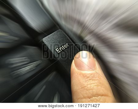 close up human finger press enter button on computer keyboard