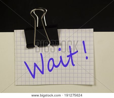 Paper clip with piece of squared paper