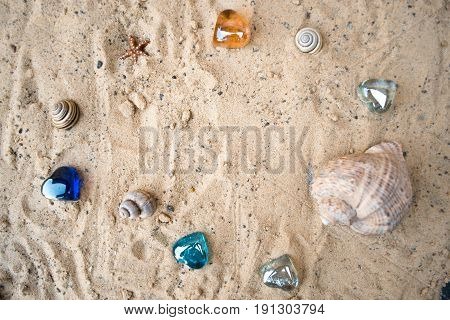 Hearts on a sandy sunny beach with a blurred background
