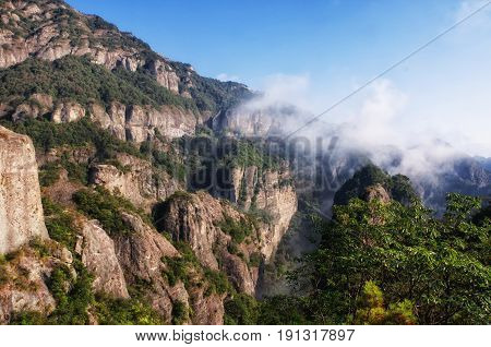 Early morning clouds hanging over Yandangshan or Yandang mountains in China in Zhejiang province.