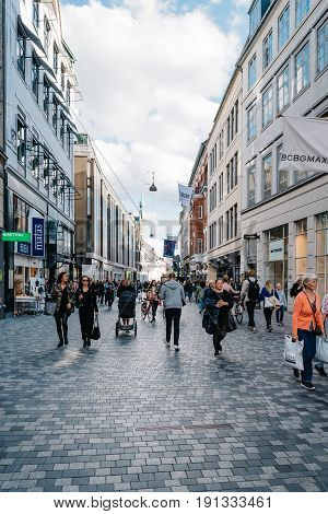 Copenhagen Denmark - August 11 2016. Stroget Street. People walking on commercial street with luxury retail shops in historical city centre of Copenhagen a sunny day of summer